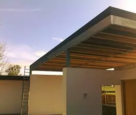 GRP carport flat roof in with custom made trim.